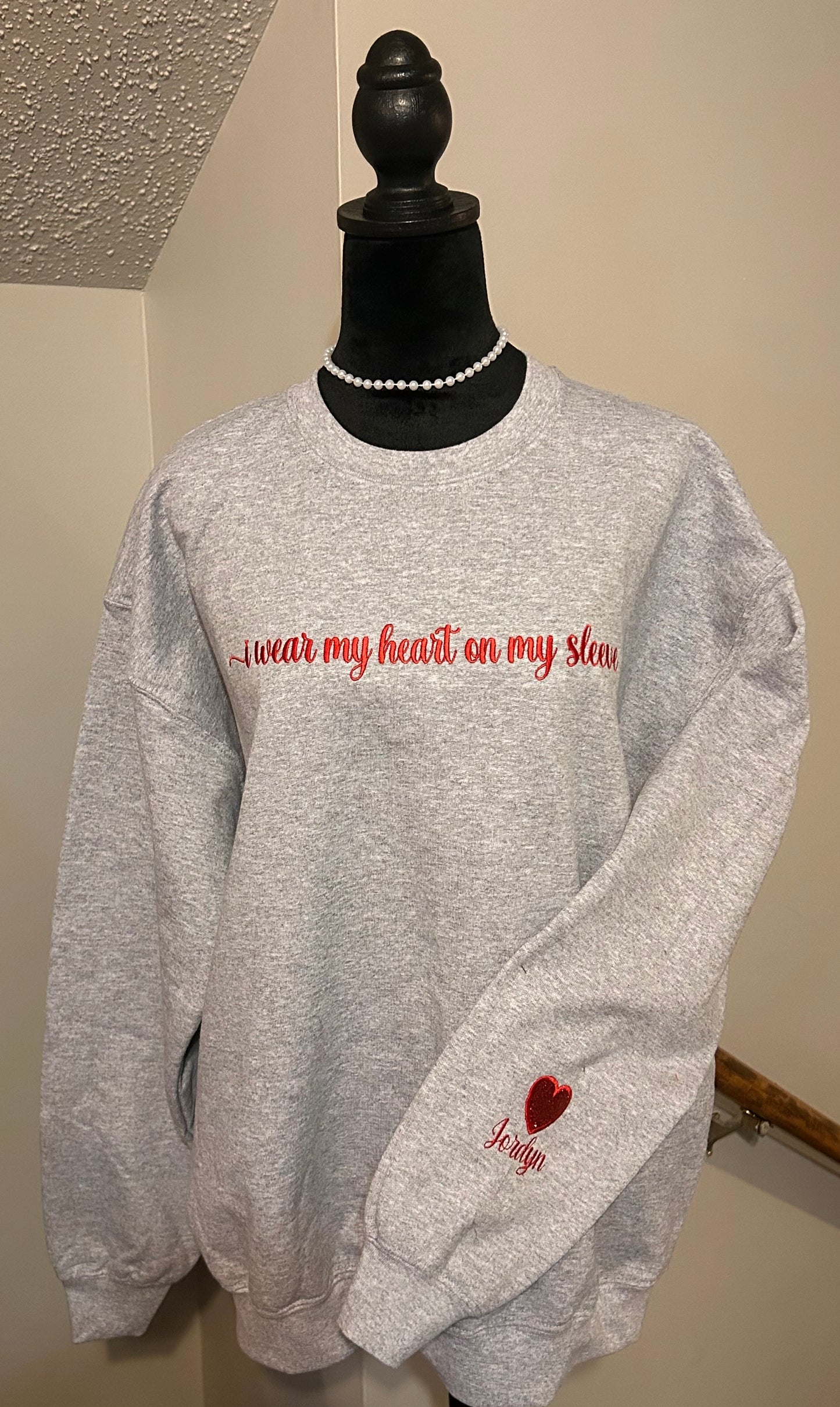 Embroidered “I wear my heart on my sleeve” Crewneck sweatshirt