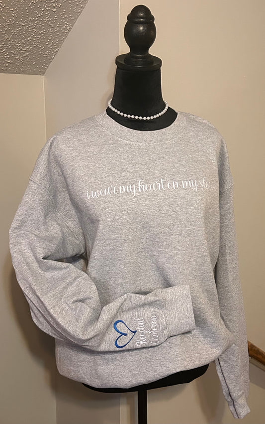 Embroidered “I wear my heart on my sleeve” Crewneck sweatshirt