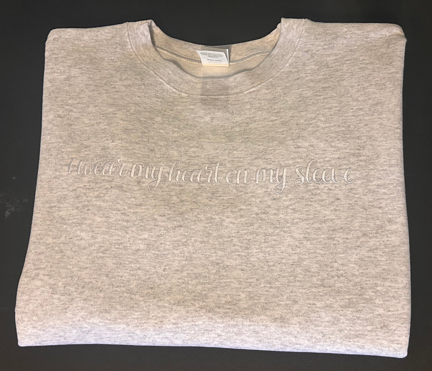 Embroidered “I wear my heart on my sleeve” Crewneck sweatshirt