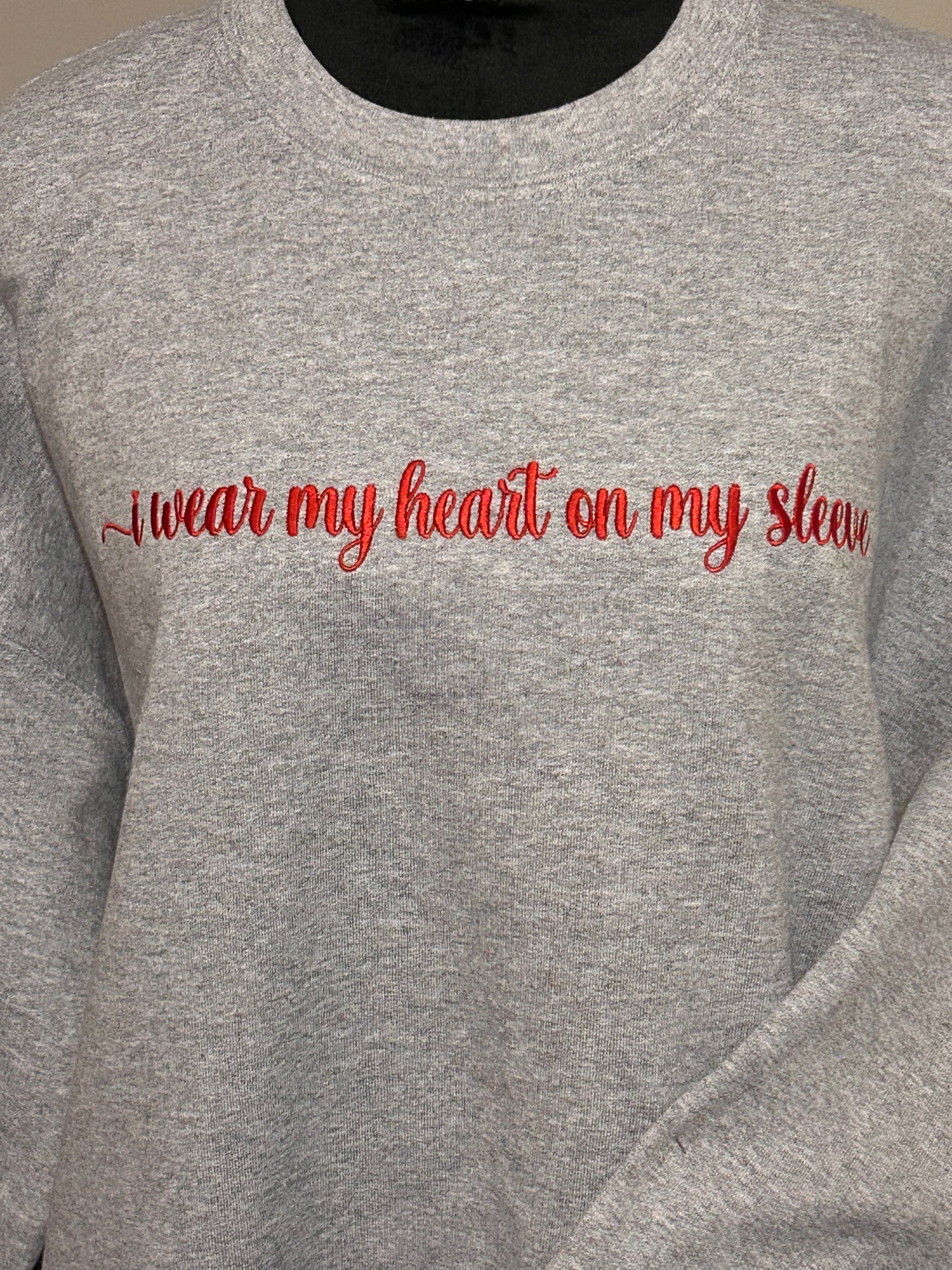 Embroidered “I wear my heart on my sleeve” Crewneck sweatshirt